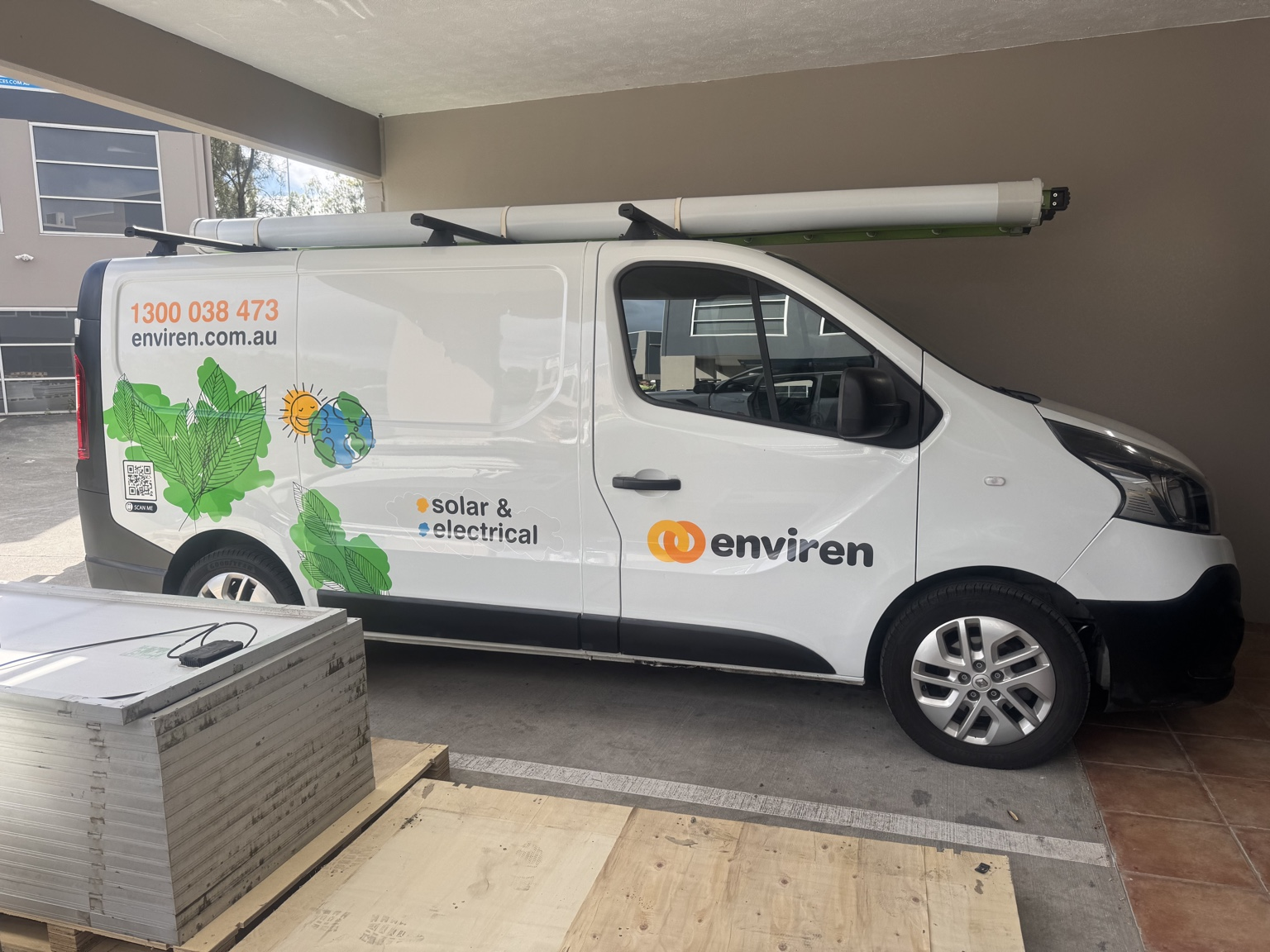 Enviren solar van in front of Brisbane home with solar panels